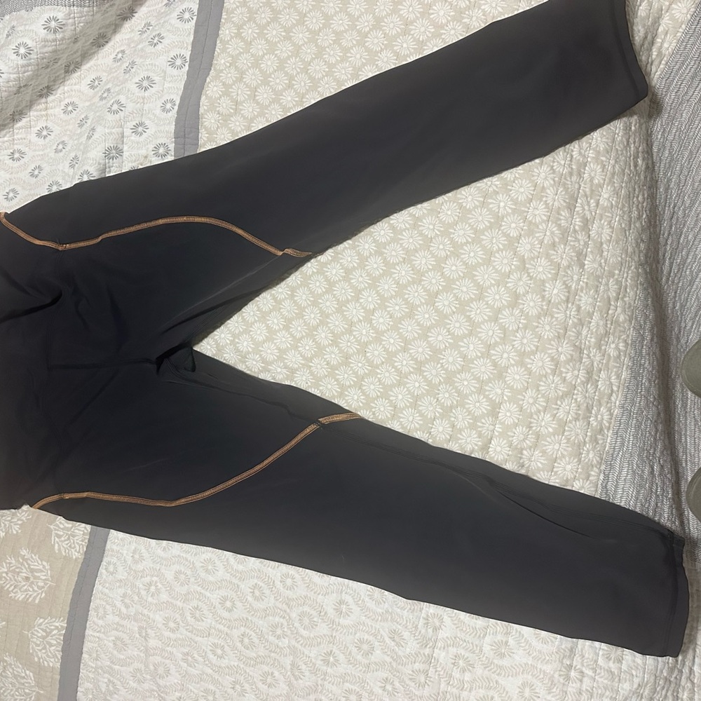 Lululemon black leggings with tan accents and pockets size 16